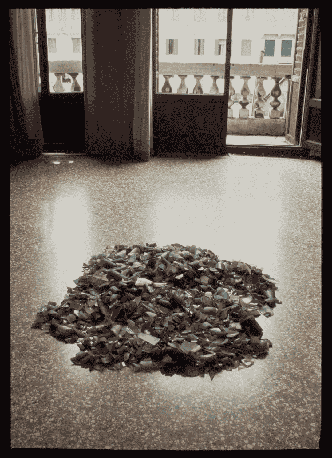 Fig. 1. Simryn Gill. 'Washed Up'. 1993–1995. Found glass, engraved. Installation view at 'Transculture: La Biennale di Venezia', 11 June–4 September 1995, Fondazione Levi, Palazzo Giustinian Lolin, Venice, Italy. © Simryn Gill. 