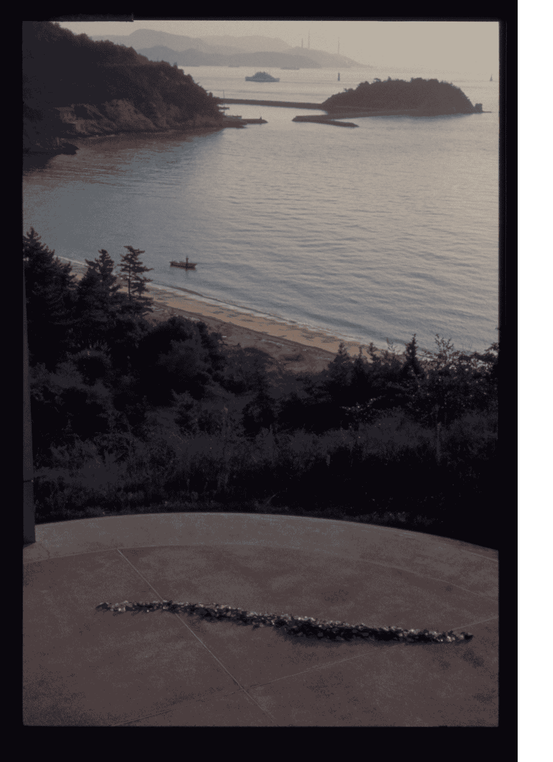 Fig. 3. Simryn Gill. 'Washed Up'. 1993–1995. Found glass, engraved. Installation view at 'Transculture: La Biennale di Venezia', 1995–1996, Naoshima Contemporary Art Museum, Kagawa, Japan. © Simryn Gill.